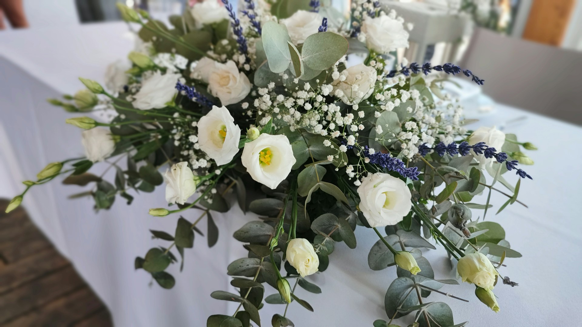 a bouquet of white and blue flowers