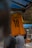 a yellow shirt from a metal pole