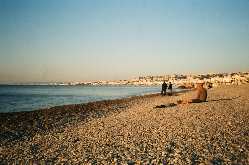 a group of people on a beach