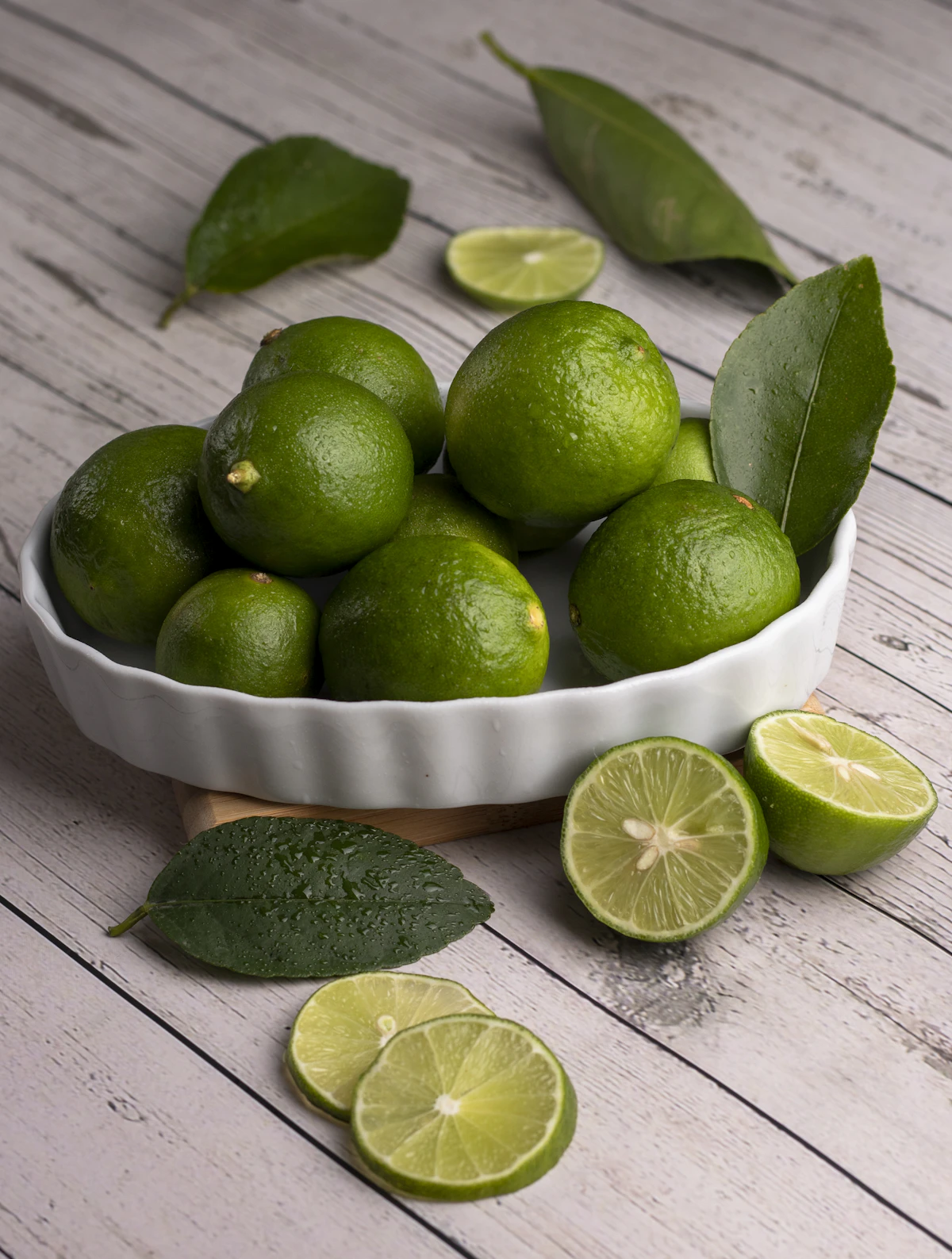 A bowl of limes - Tom Yum Soup at Home