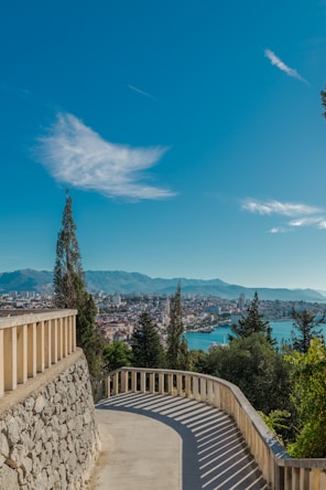 a view of a city and the water from a balcony