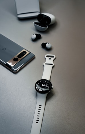 A compact travel setup featuring only smart wearables and no bulky phone in sight.