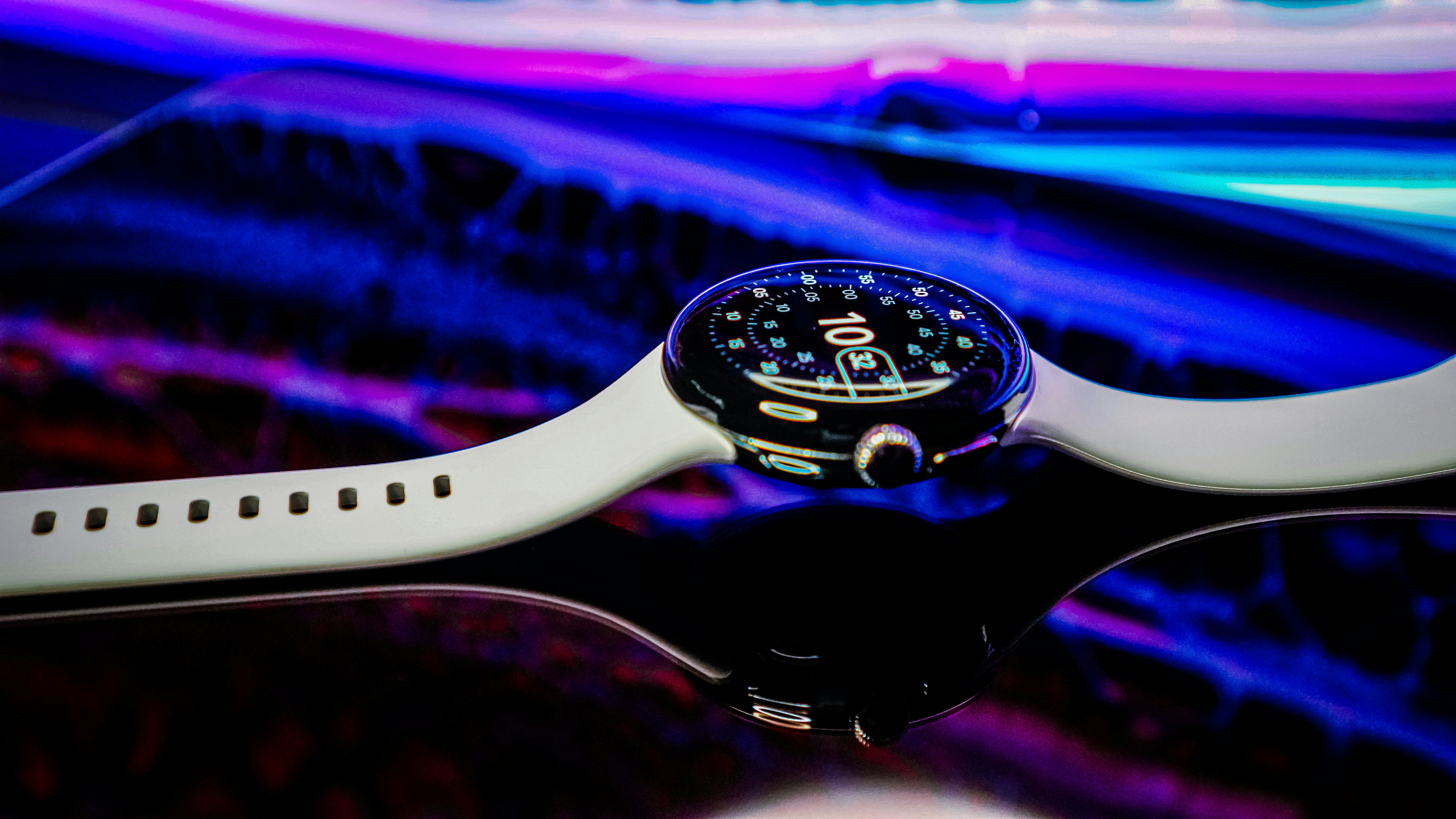 Premium smartwatch on wrist, dark atmospheric background, amber light reflection on watch face