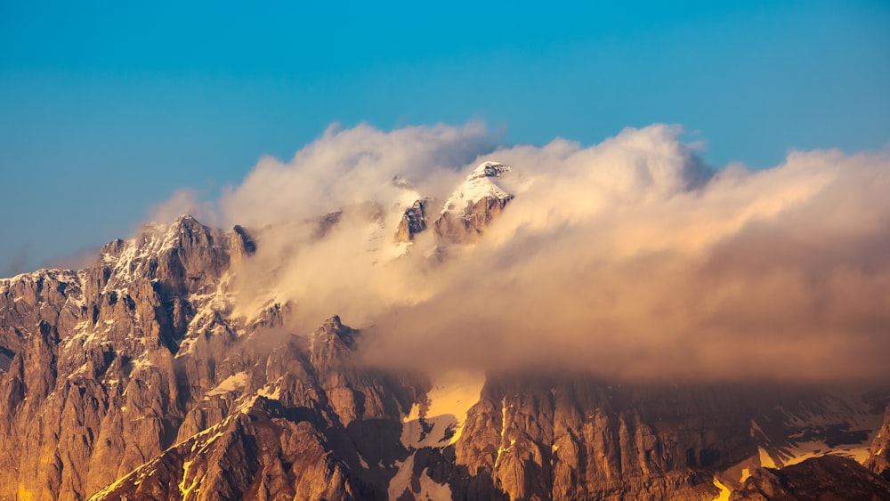 a mountain with clouds