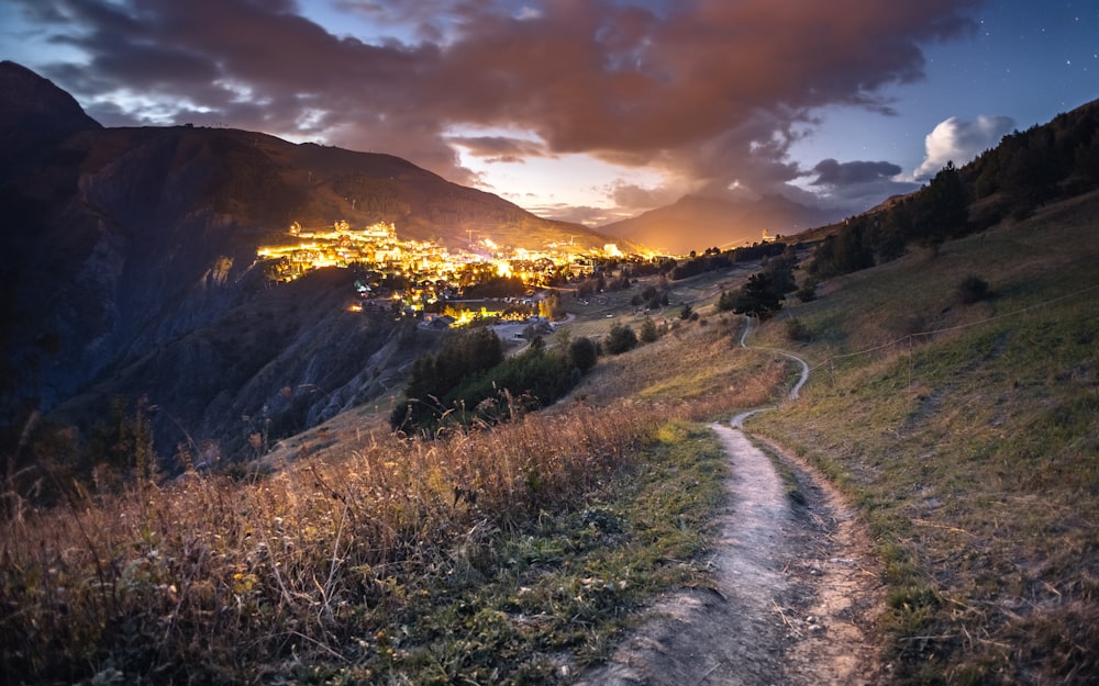 a dirt road going through a valley