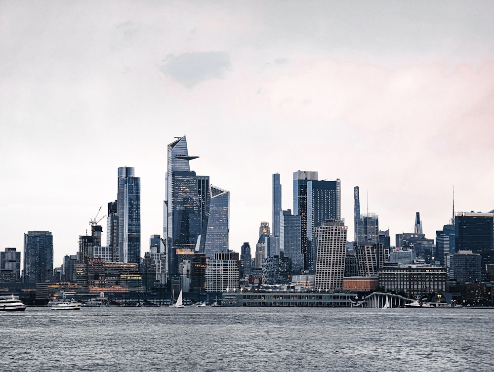 a city skyline with a river