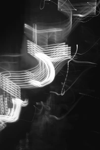 Abstract golden light trails swirling over a dark textured surface, symbolizing energy flow.