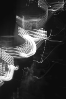 Abstract waves of light flowing over a dark background