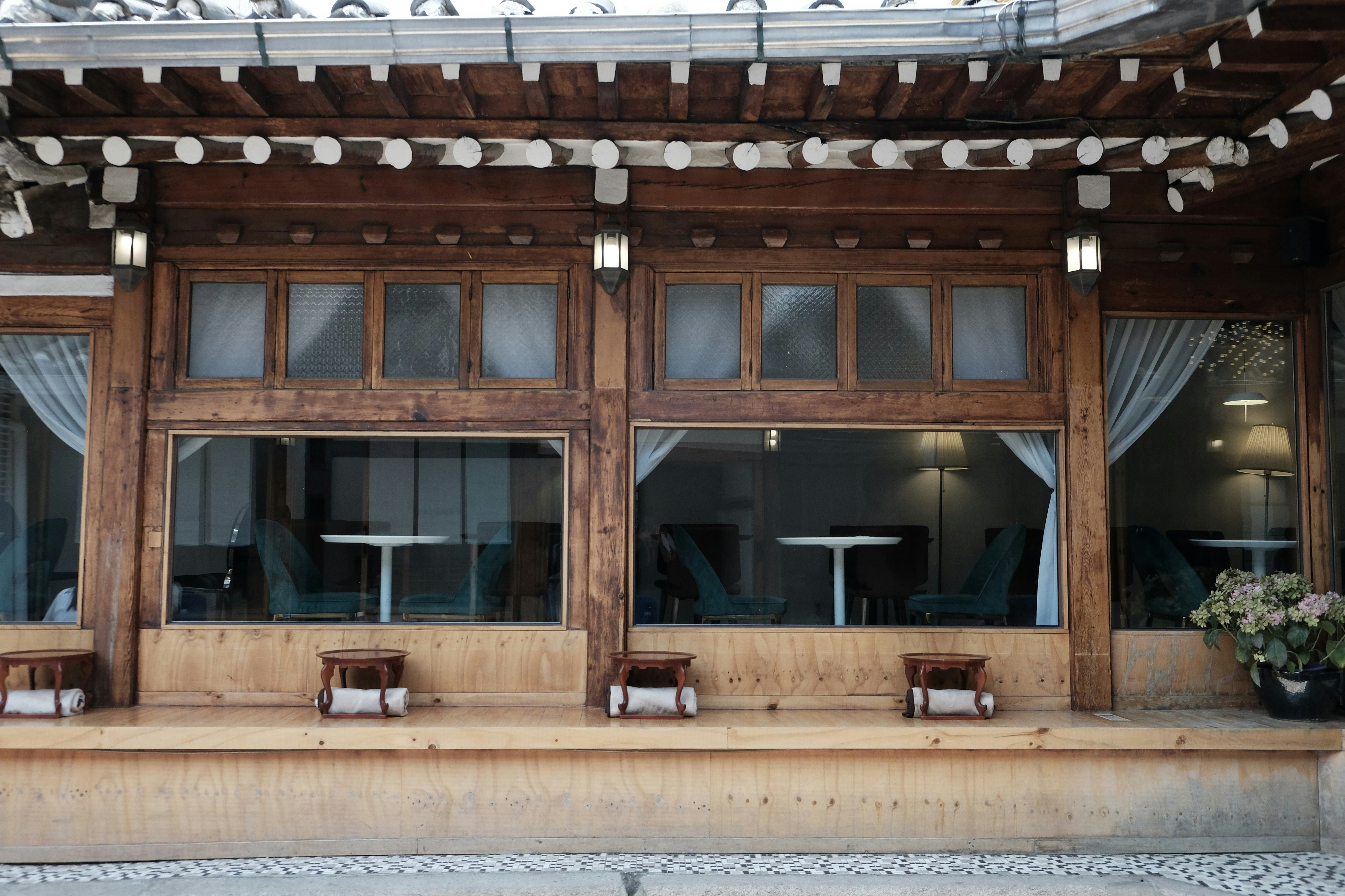 a wooden building with windows, 