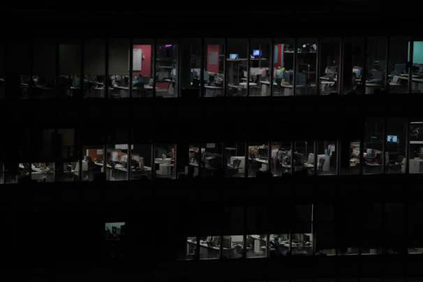 Emergency data recovery team working late hours in a secure, dark-themed office.