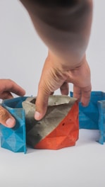 a person holding a piece of wood