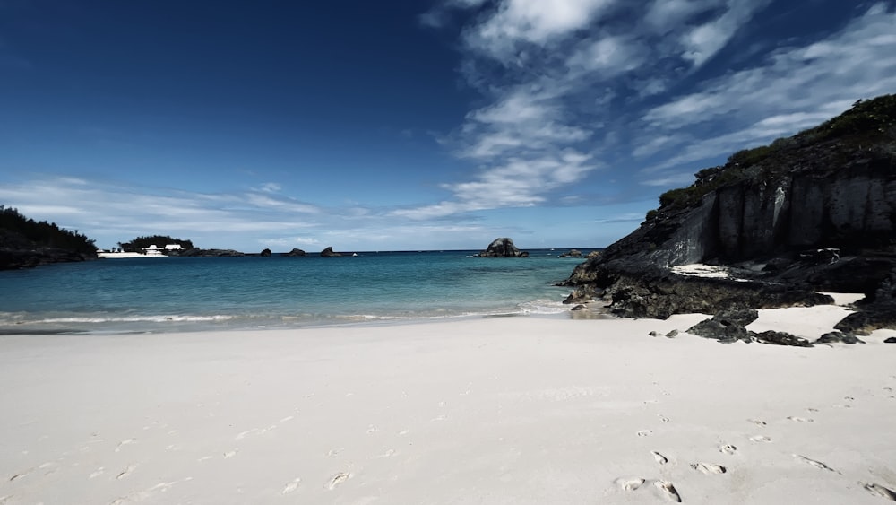 a beach with rocks and water