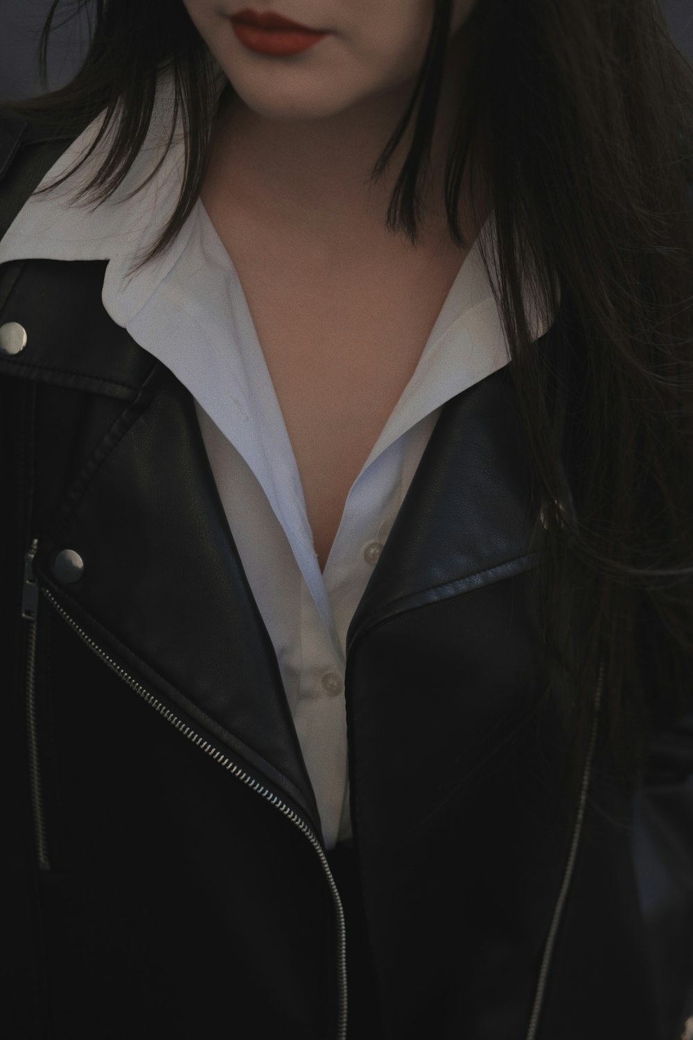 a woman wearing a black jacket
