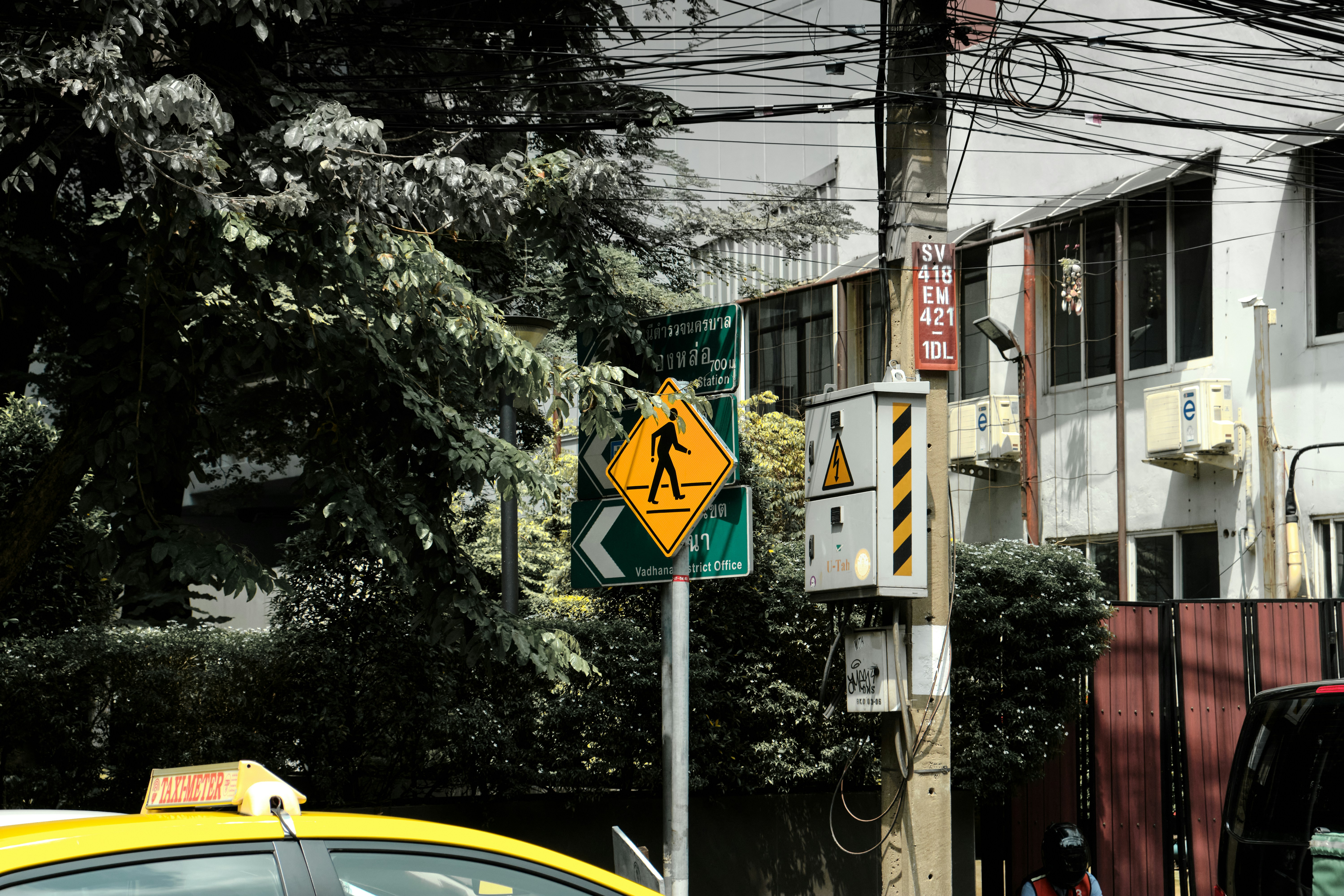 a street sign is posted on a pole