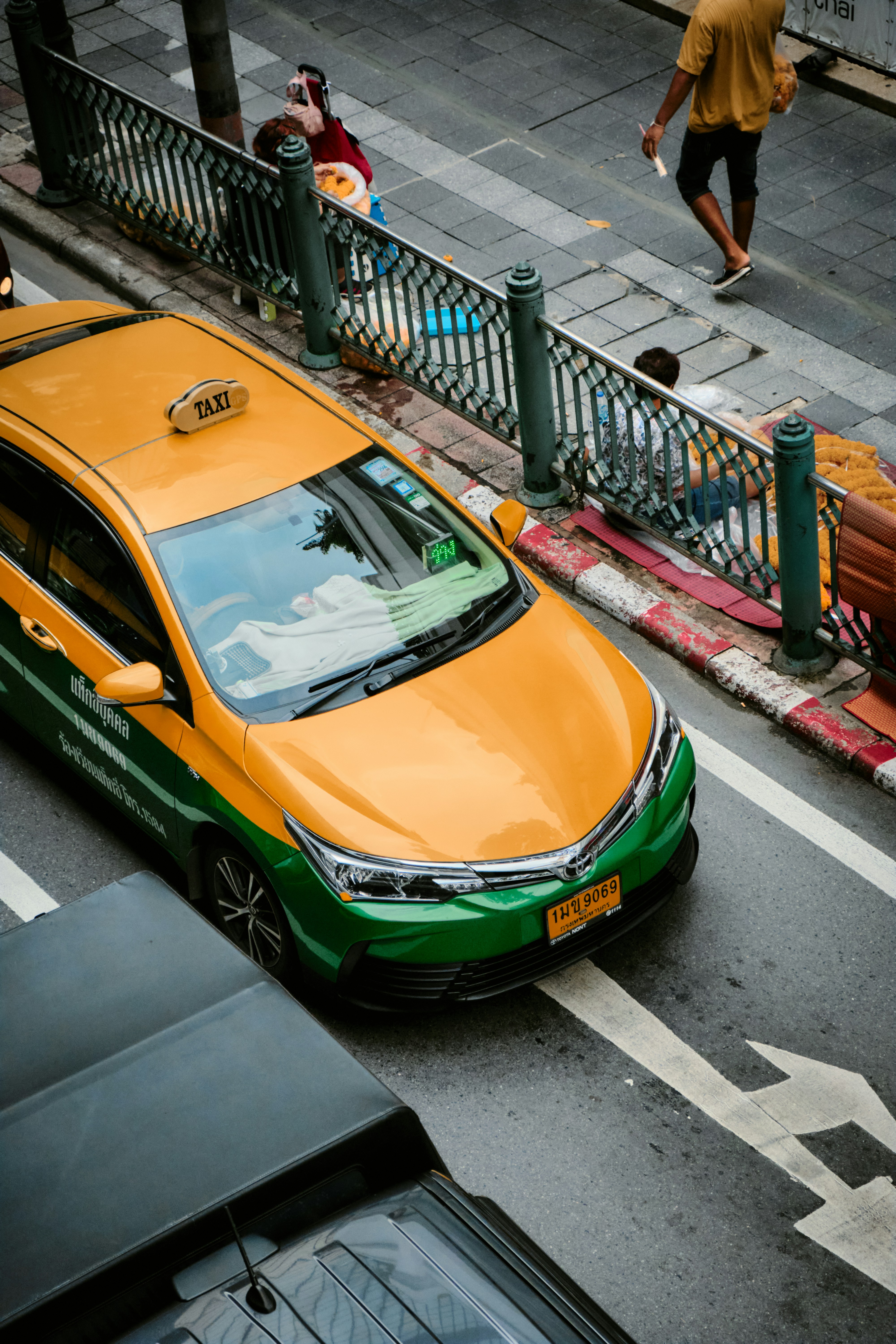 a yellow sports car on a street