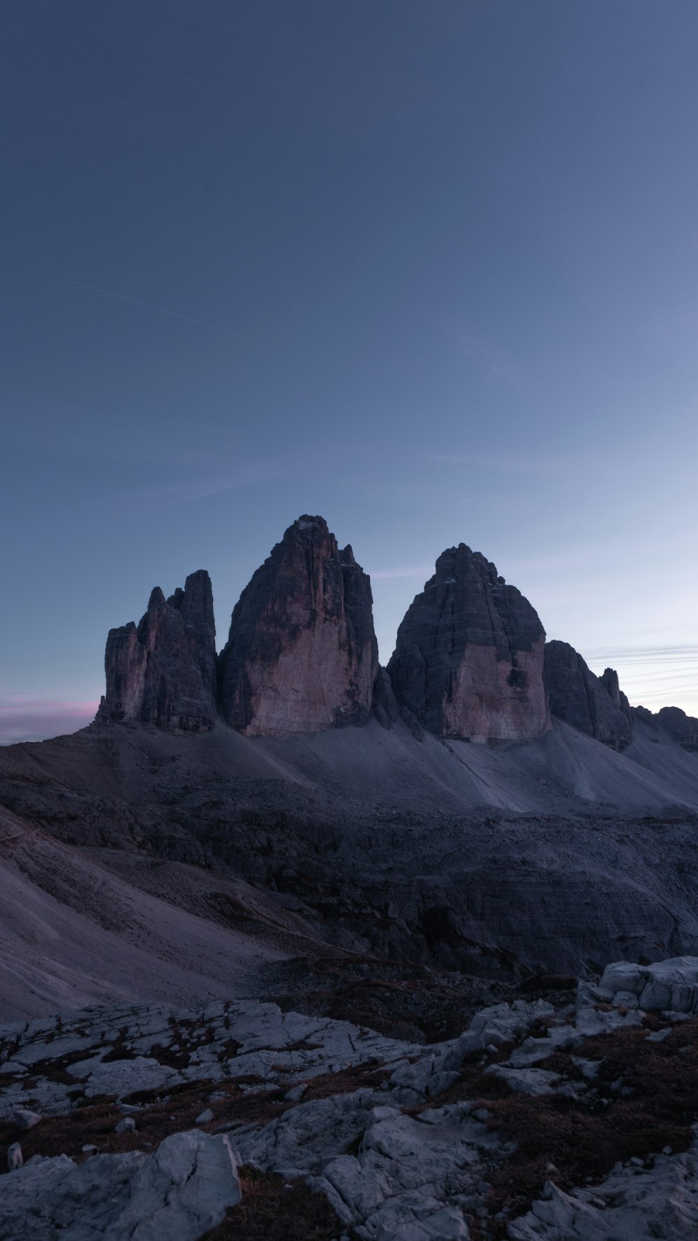 a rocky mountain with snow