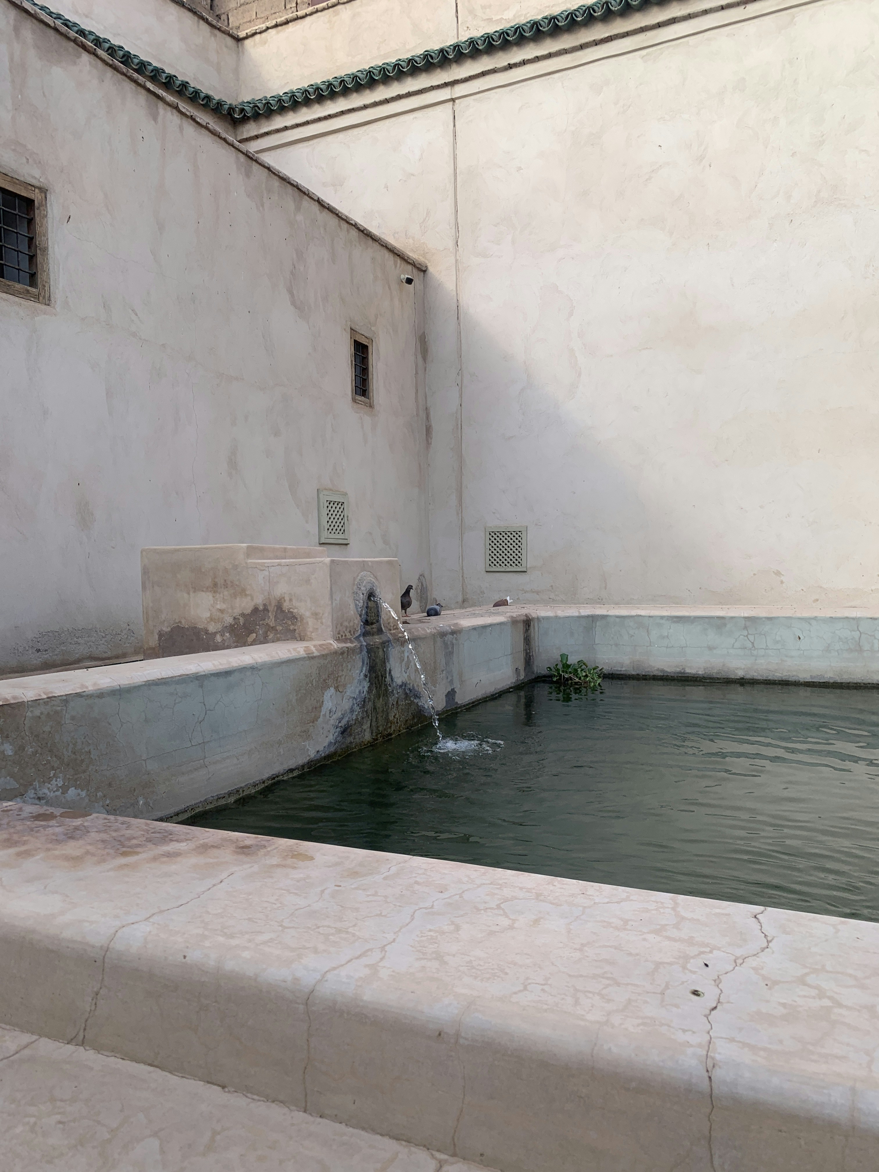 a fountain in a courtyard