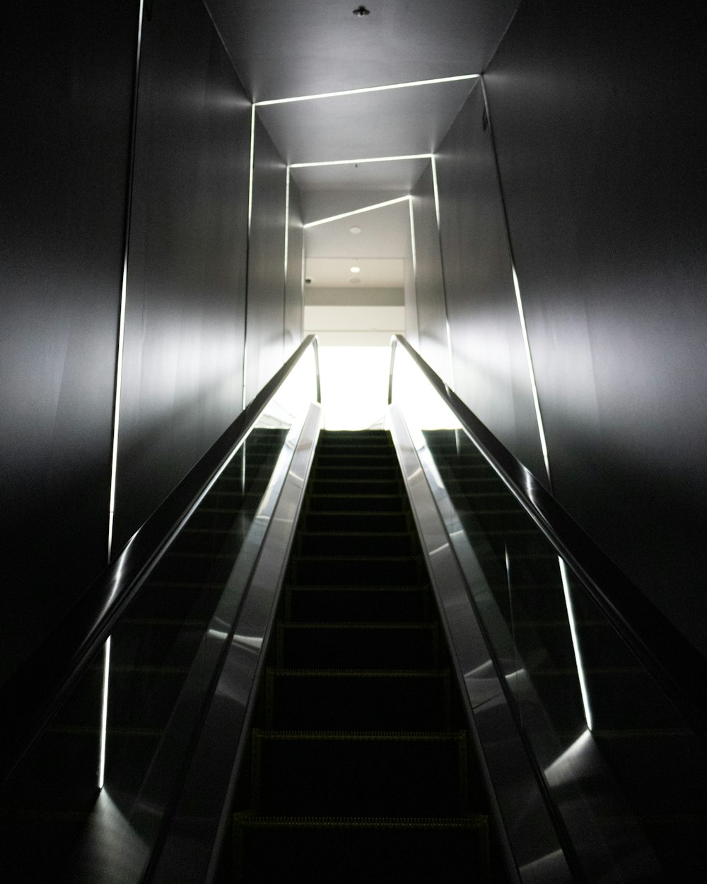 a dark staircase with light at the top