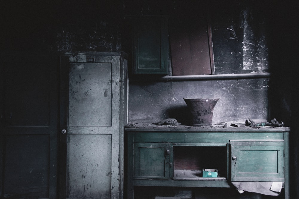 a kitchen with a stove and a pot on top