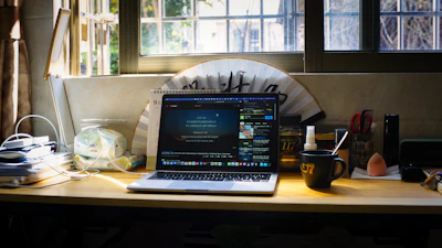 a laptop sits on a desk