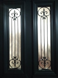 Elegant glass door featuring a custom etched geometric design catching natural light.