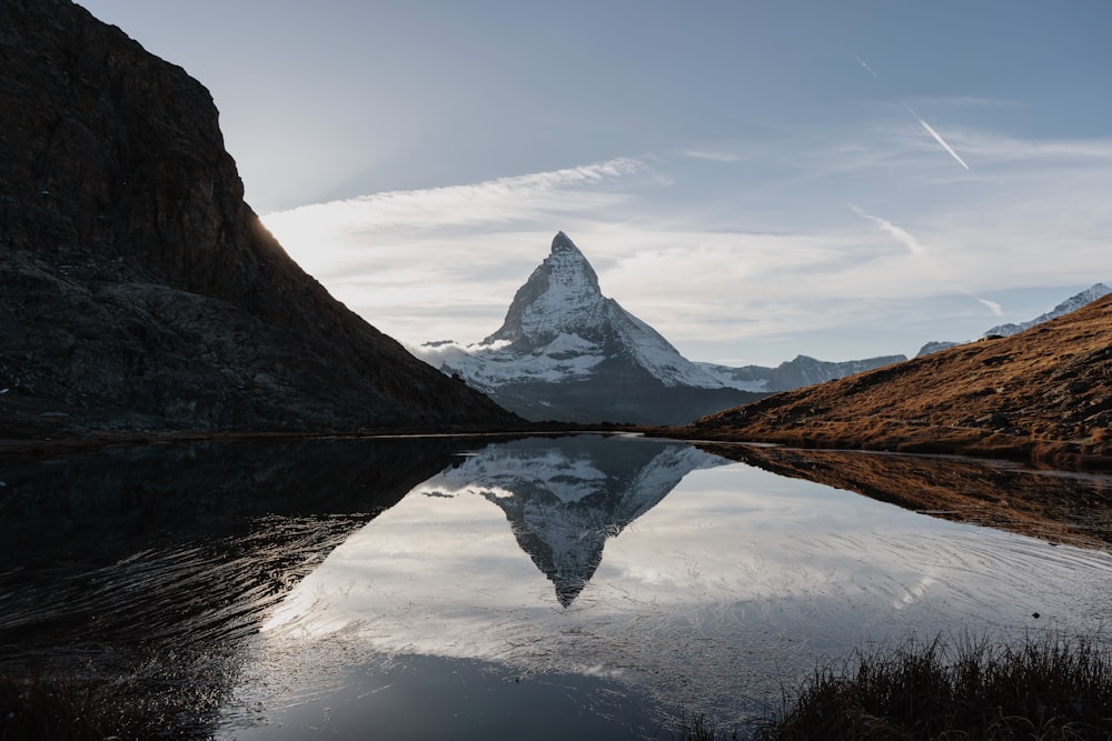 a lake with a mountain in the background