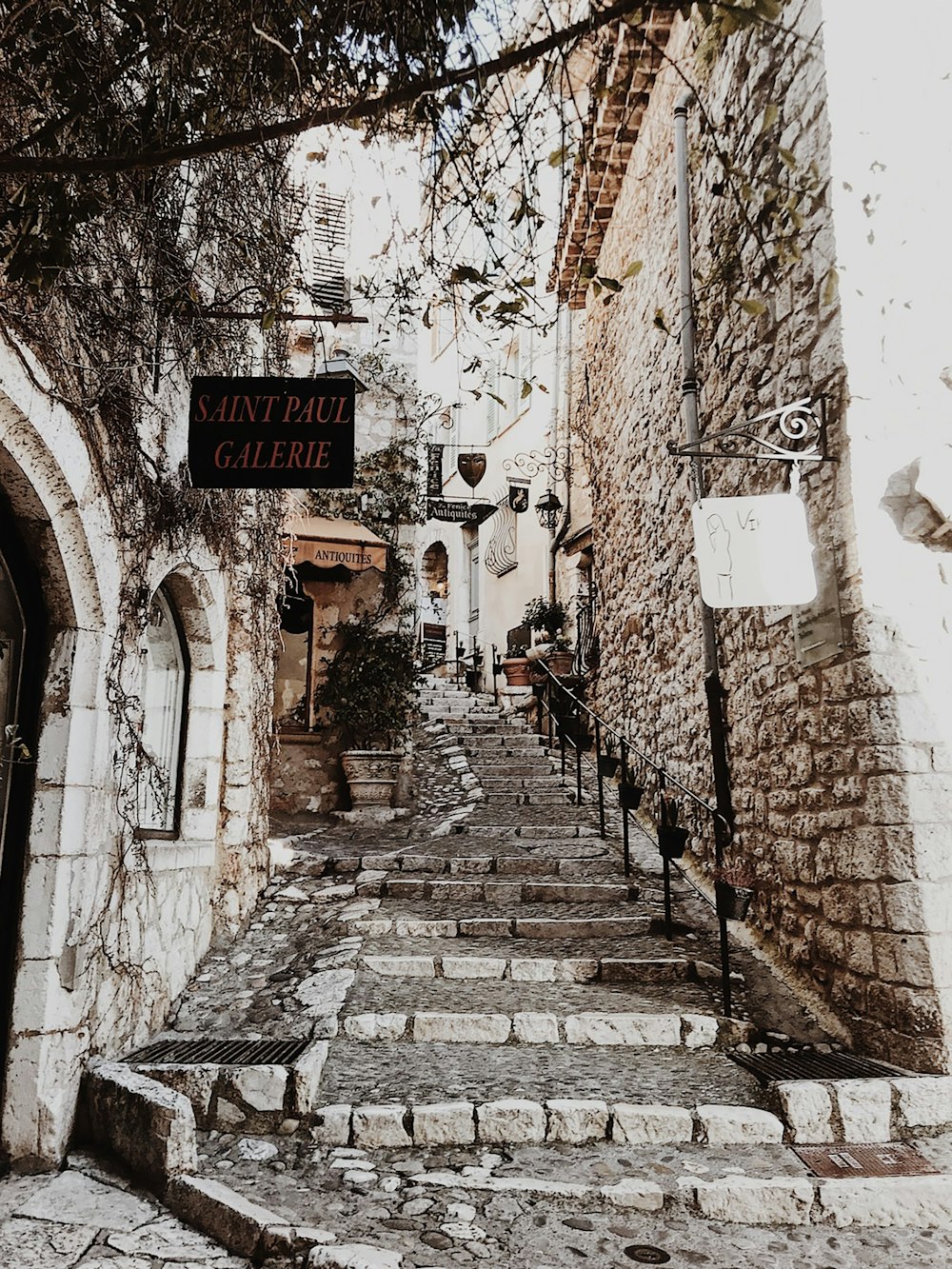 a stone street with a sign on it