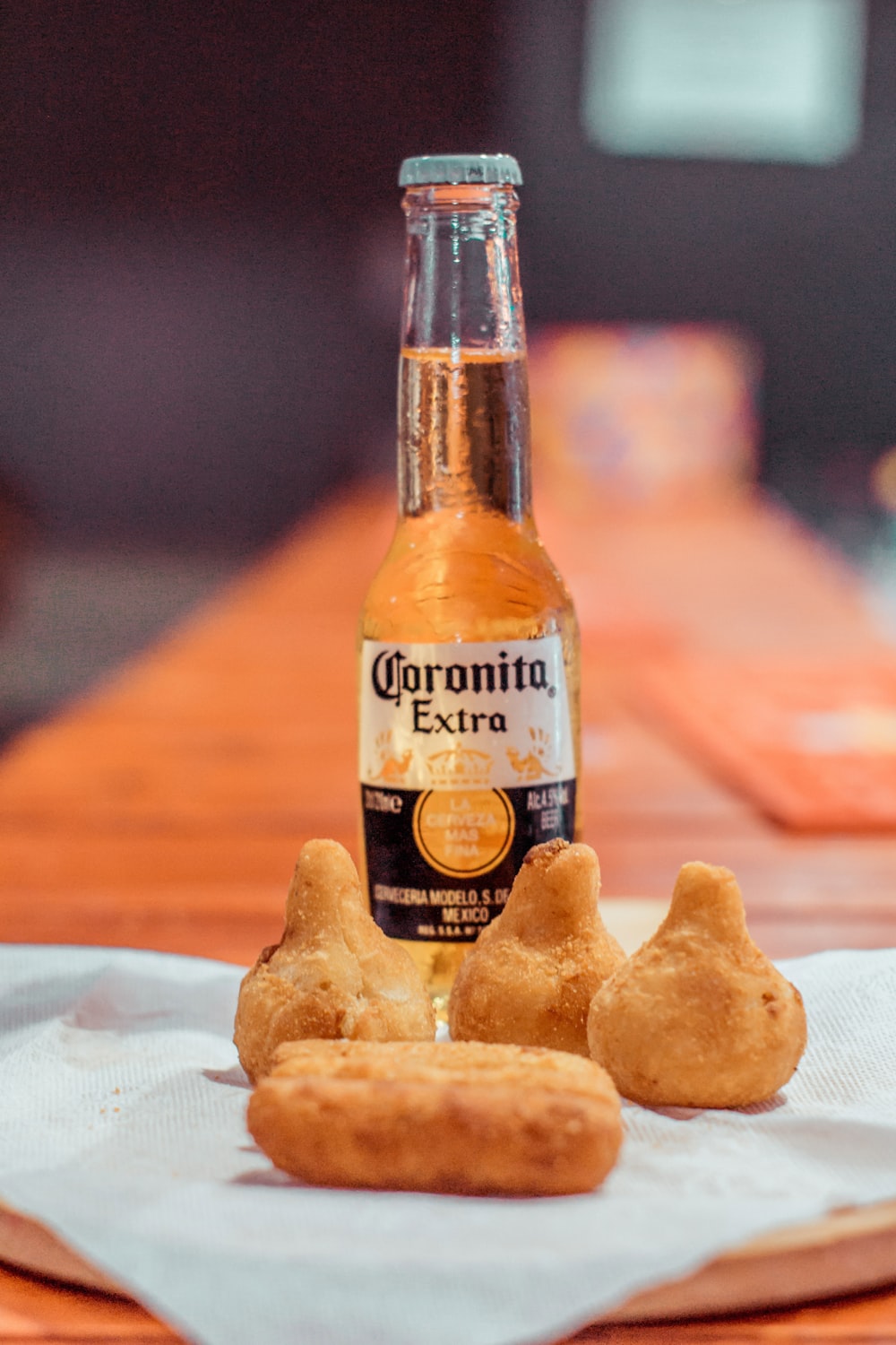 a bottle of beer on a plate with bread