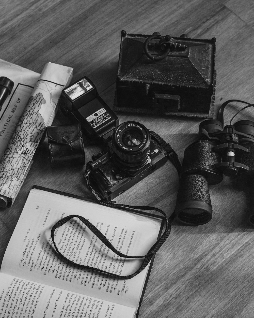 a group of cameras and papers