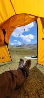 a person lying under a tent