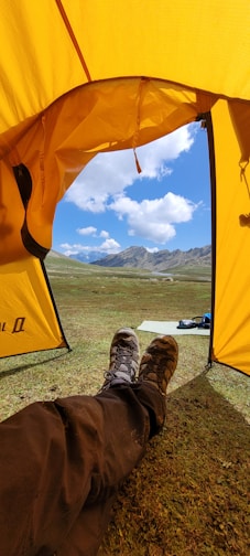 a person lying under a tent