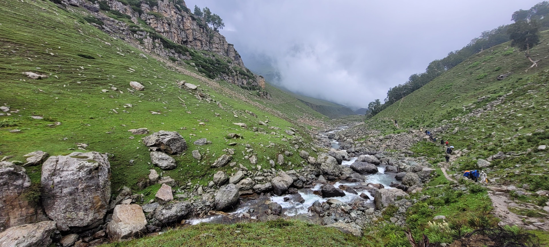 a rocky river with people on it