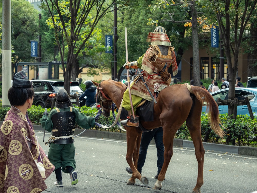 a man in a garment riding a horse with a child