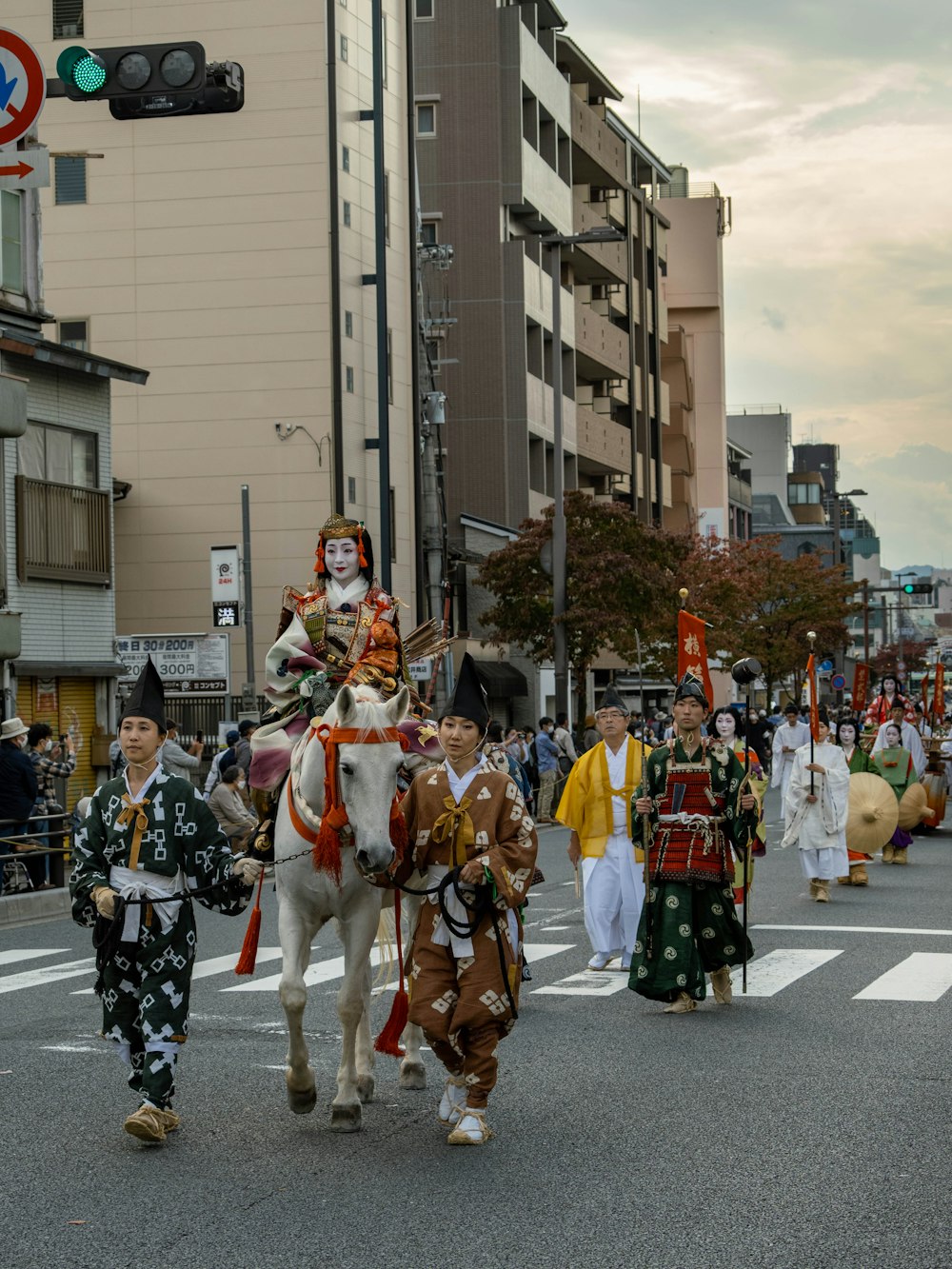 a group of men in clothing on a street