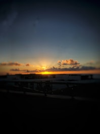 A candid photo of Matheo Munoz capturing a sunset over a cityscape.