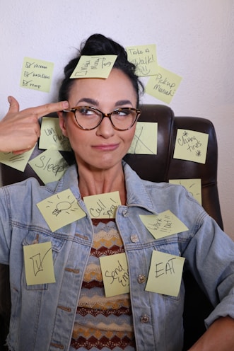 Overwhelmed woman surrounded by notes — representing client frustration with editing process