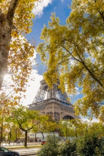 An iconic landmark framed by colorful flowers and a bright, sunny day.