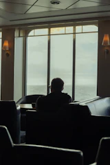 A calm, cozy room with soft lighting and a comfortable chair inviting personal reflection.