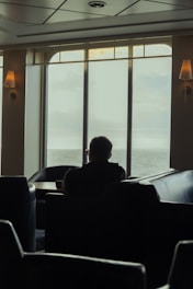 A serene person sitting peacefully in a cozy room, reflecting calm and clarity.