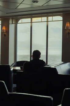 A calm, cozy room with soft lighting and a comfortable chair inviting personal reflection.