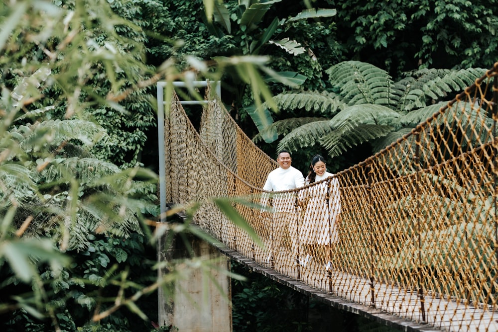 a couple of people standing in a cage