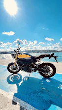 A vibrant Yamaha motorcycle parked on a sunny street in San José del Guaviare.