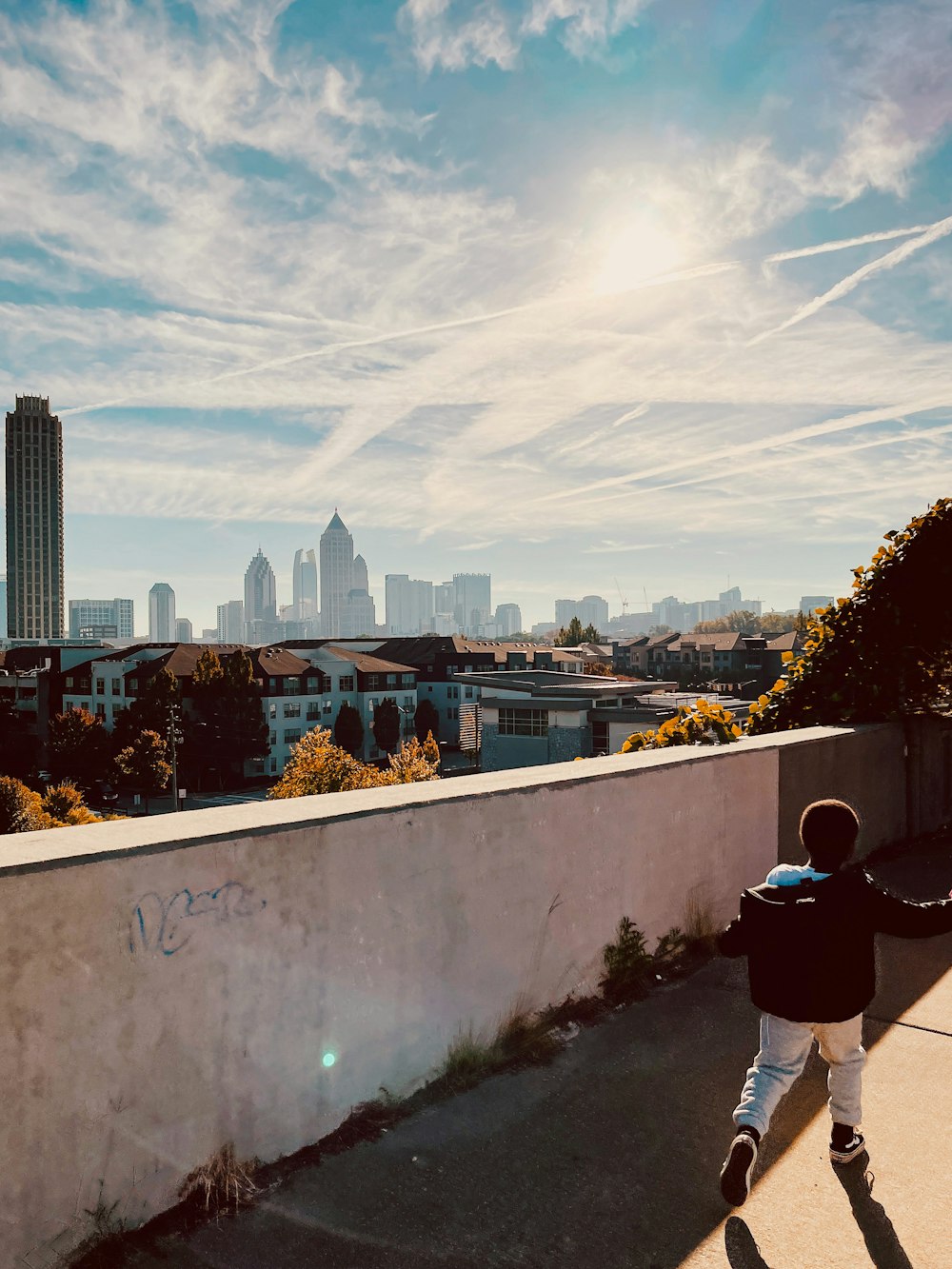 a child jumping on a wall