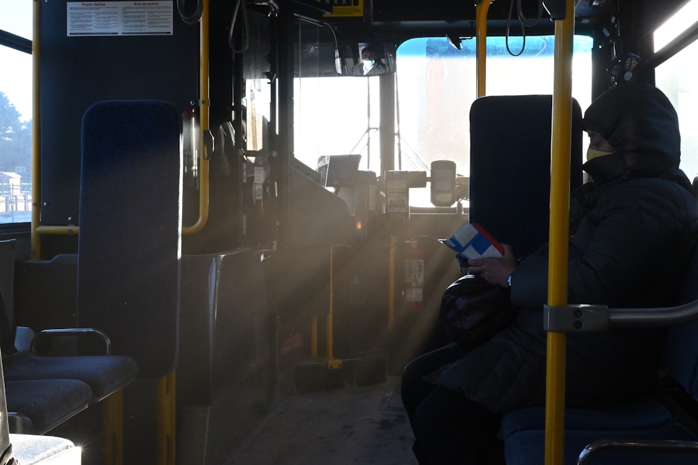 a person sitting on a bus