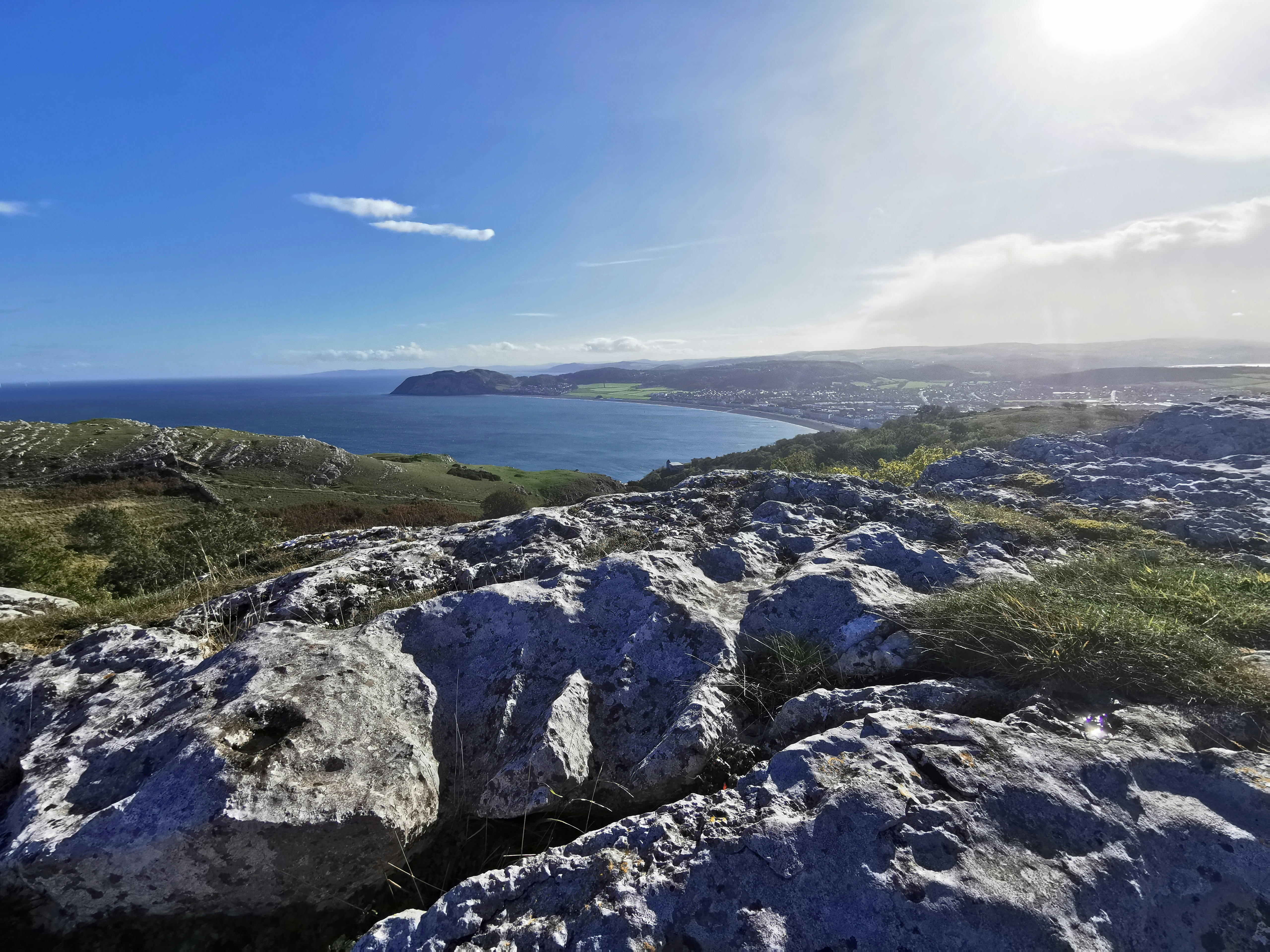 a rocky cliff overlooking a body of water