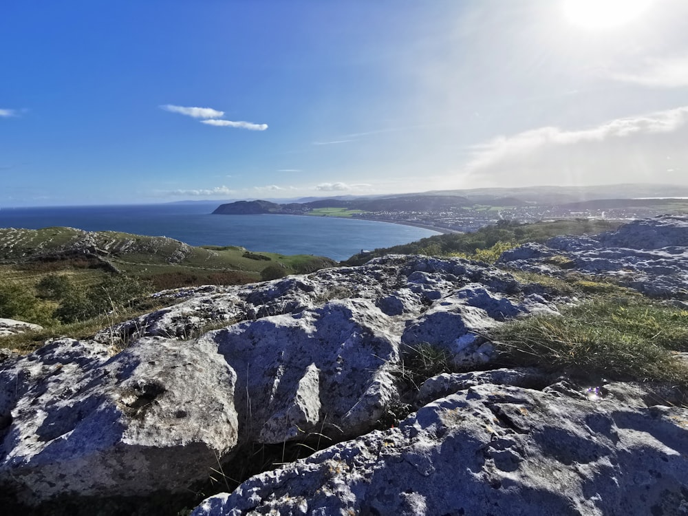 a rocky cliff overlooking a body of water