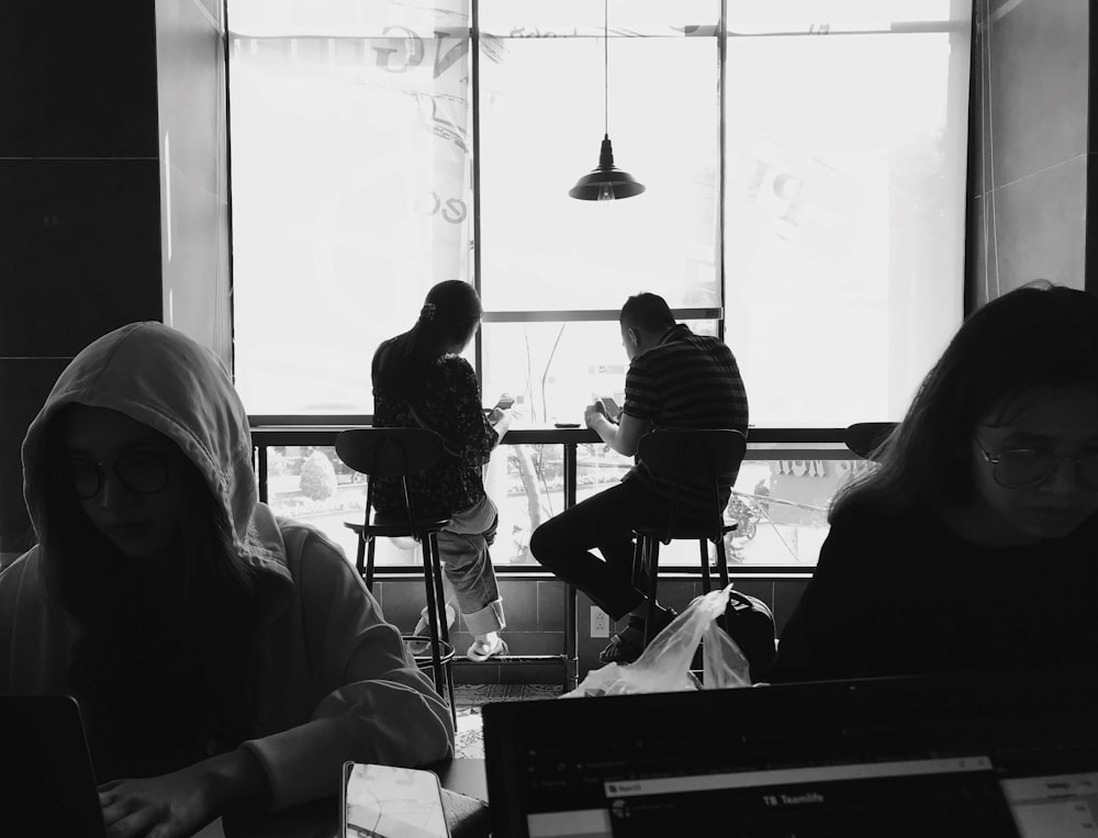 a group of people sitting at a table