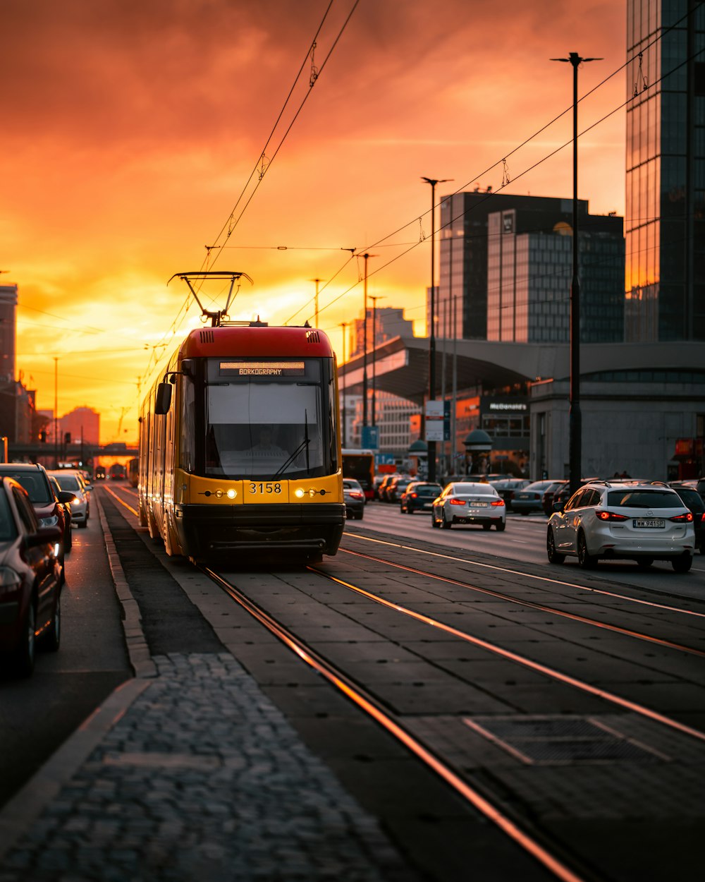 a yellow train on the tracks