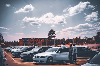 a group of cars parked in a parking lot