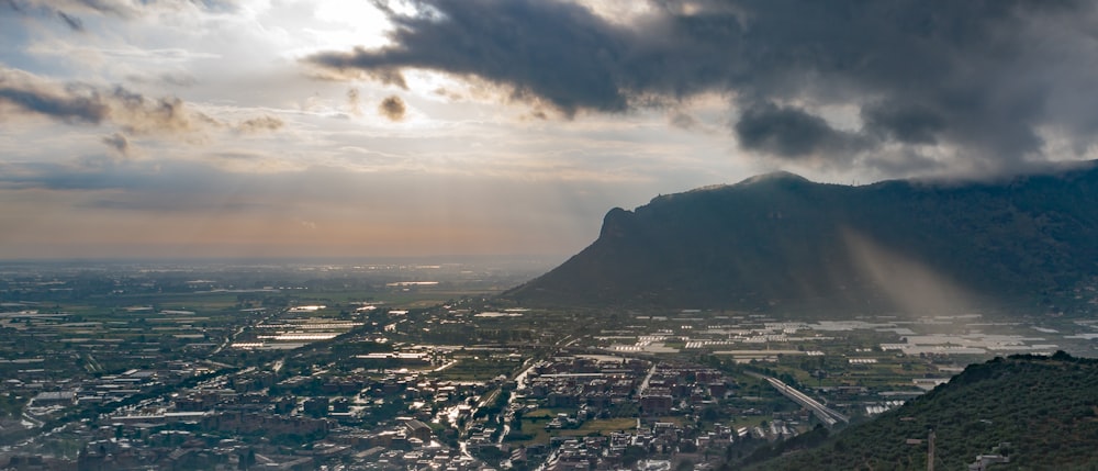 a city with a mountain in the background